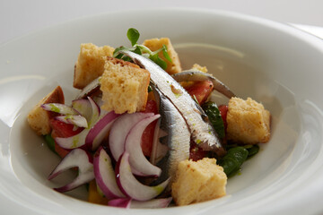 Delicious fresh caesar salad, with anchovies. Shallow dof