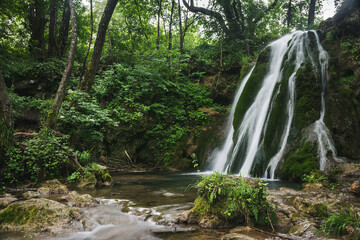 Fototapeta premium Beautiful waterfall in the forest near village Donji Taor, near city of Valjevo in Western Serbia