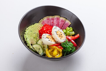 Organic food. Tuna poke bowl with crystal noodles, fresh red cabbadge, avocado, cherry tomatoes. Food concept poke bowl on white background, Top view, Closeup.