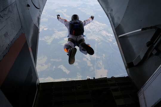 Skydiving. Start jump. A skydiver has just jumped out of a plane into the sky.