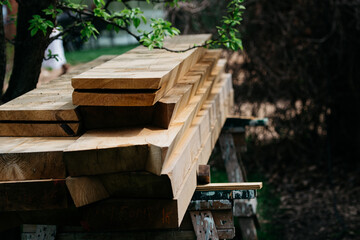 Stack of wooden planks cut for construction