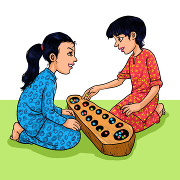 Kid girls playing Congkak, the Asian Traditional Games