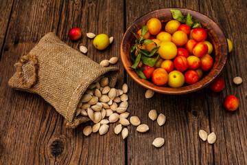 Harvest ripe cherry plum with seeds on wooden background