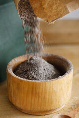 flour with black cumin on the wooden table