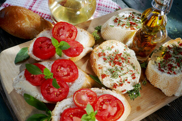top-view of a  healthy sandwiches with  tomato and basil ,savory, olive oil on table.