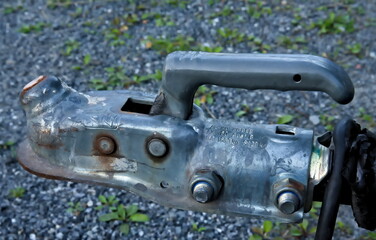 Trailer coupling on a tow bar for attaching to a car or truck, close up.