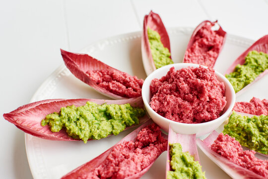 Beet Hummus and Minty Peas Spread in Red Belgian Endive Boats