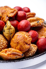 Tasty asian vegetarian appetizer, crunchy rice en peanuts snacks from Japan close up on white backgound
