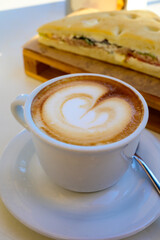 Breakfast coffee, Italian classic cappuccino with milk foam served in cafe