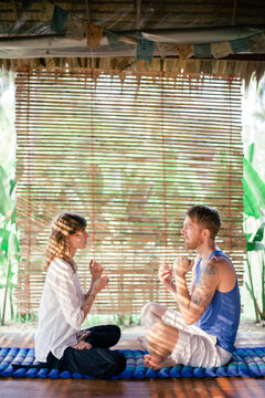 Therapist guiding the client in tropical retreat center to EFT (Emotional Freedom Technique)