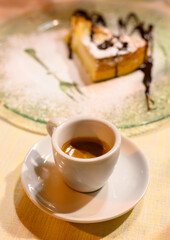 Classic italian espresso coffee served with homemade apple cheese cake with chocolate