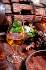 Tasting of aged french cognac brandy in old cellars of cognac-producing regions Champagne or Bois, France