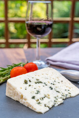 French cheeses collection, piece of roquefort, sheep milk soft blue cheese from Southern France.