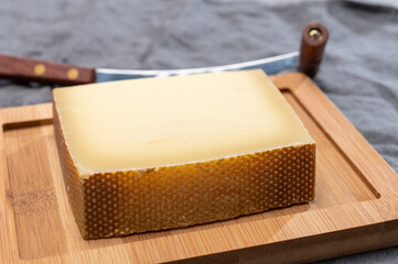 Block of Swiss medium-hard matured cheese gruyere used for baking, quiche, fondue, sandwiches