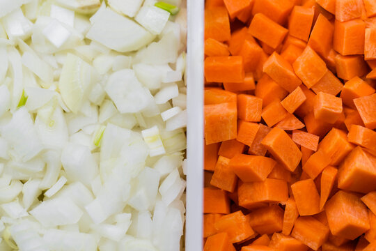 Closeup of chopped white onion and carrot