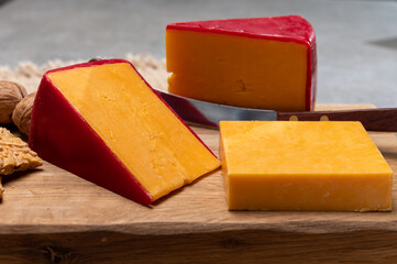 Red waxed yellow cheddar cheese close up