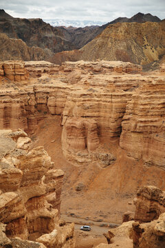 Car driving in a Charyn canyon, Kazakhstan