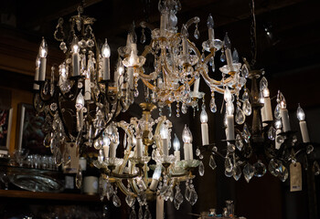 Old crystal chandeliers in an antique shop