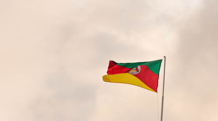 Flag of the Brazilian State of Rio Grande do Sul raised on the mast.