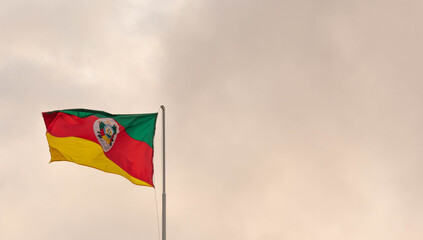 Flag of the Brazilian State of Rio Grande do Sul raised on the mast.