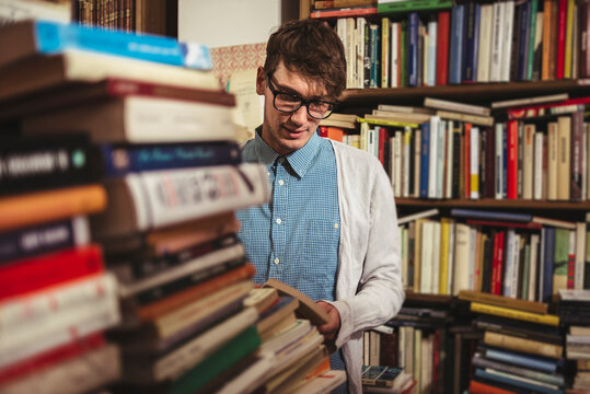 Young man in a book store