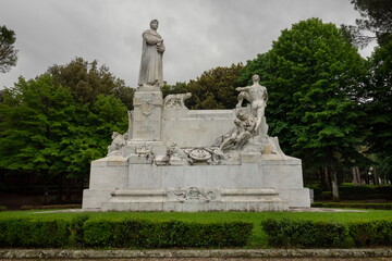 Fototapeta na wymiar Monument to Francesco Petrarca, located in the center of the park of the Medici Fortress, was built in 1928 by Alessandro Lazzerini