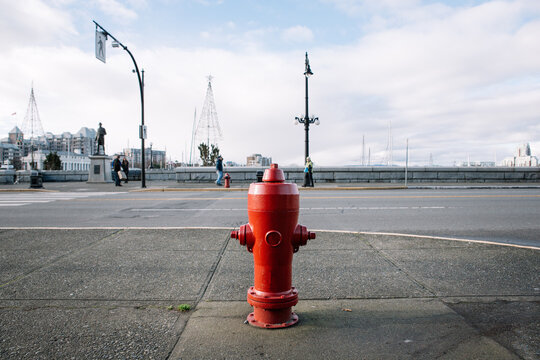 Red fire hydrant at the corner of a street