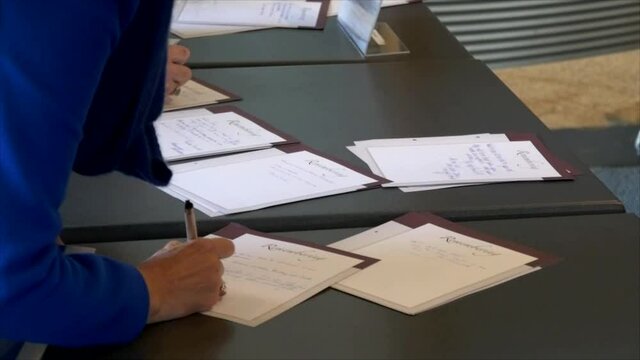 People Signing The Covid19 Contact Tracing List When Entering Premises In New Zealand After Lock Down