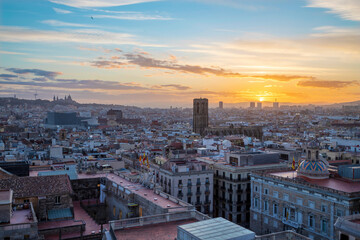 Barcelona - The sunset over the city with the Santa Maria del Pi gothic church in the centre.