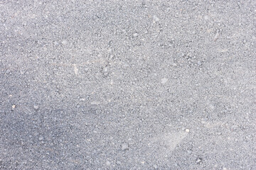 New dirty asphalt road surface after construction time.