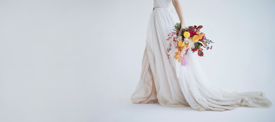 Bride walks with autumn bouquet banner