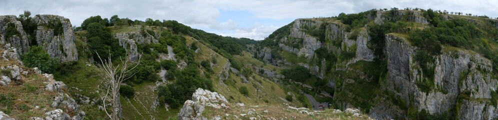 Cliffs of Cheddar Gorge from high viewpoint. High limestone cliffs in canyon in Mendip Hills in Somerset, England