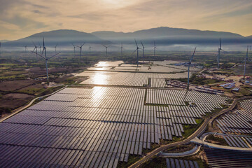 solar energy panels and wind turbine. Drone view
