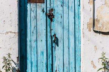  closed, blue  , old door with lock and handle