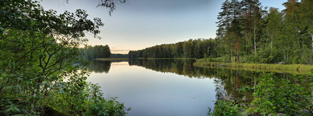 Evening panorama of the forest, mirror lake