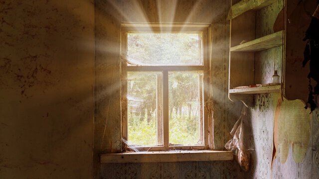 bright sunlight lit through old window with wooden frame in village house