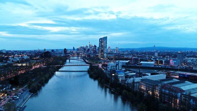 Cityscape and river at dusk, Frankfurt, Hesse, Germany