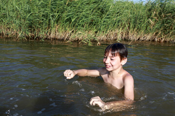 Kid swimming in lake