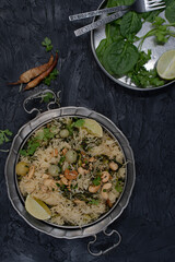 Vegan rice pilaf made with roasted green tomatoes, nuts, seeds, spices