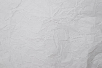 Crumpled white paper background.