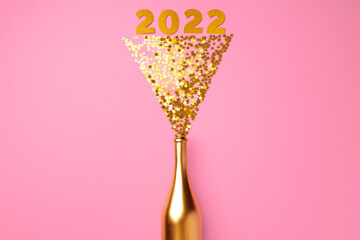 Champagne bottle with confetti flat lay top view