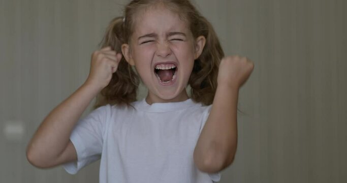 Child Shouting Loud. Portrait of Shocked, Angry and Emotional Little Girl. Young Angry Girl Yelling Screaming Slow Motion. Upset Child Scream Loudly. Adhd Attention Deficit Hyperactivity Disorder.