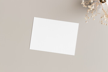 White invitation card mockup with gypsophila. 5x7 ratio, similar to A6, A5.