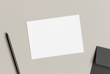 White invitation card mockup with envelope, 5x7 ratio, similar to A6, A5. Workspace concept.