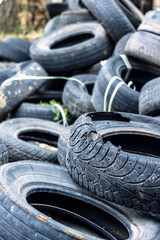 A bunch of old tires from used cars.