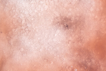 Fototapeta premium background and texture of pink lake, salt covered with water