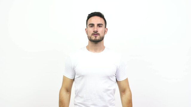 Young caucasian man tired and bored, doing a timeout gesture, needs to stop because of work stress, time concept