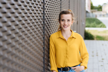 Fototapeta premium Relaxed young woman with a friendly smile