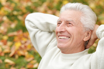 Portrait of happy senior man in park