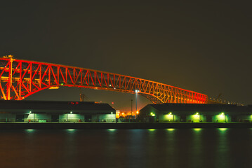 a red bridge at night